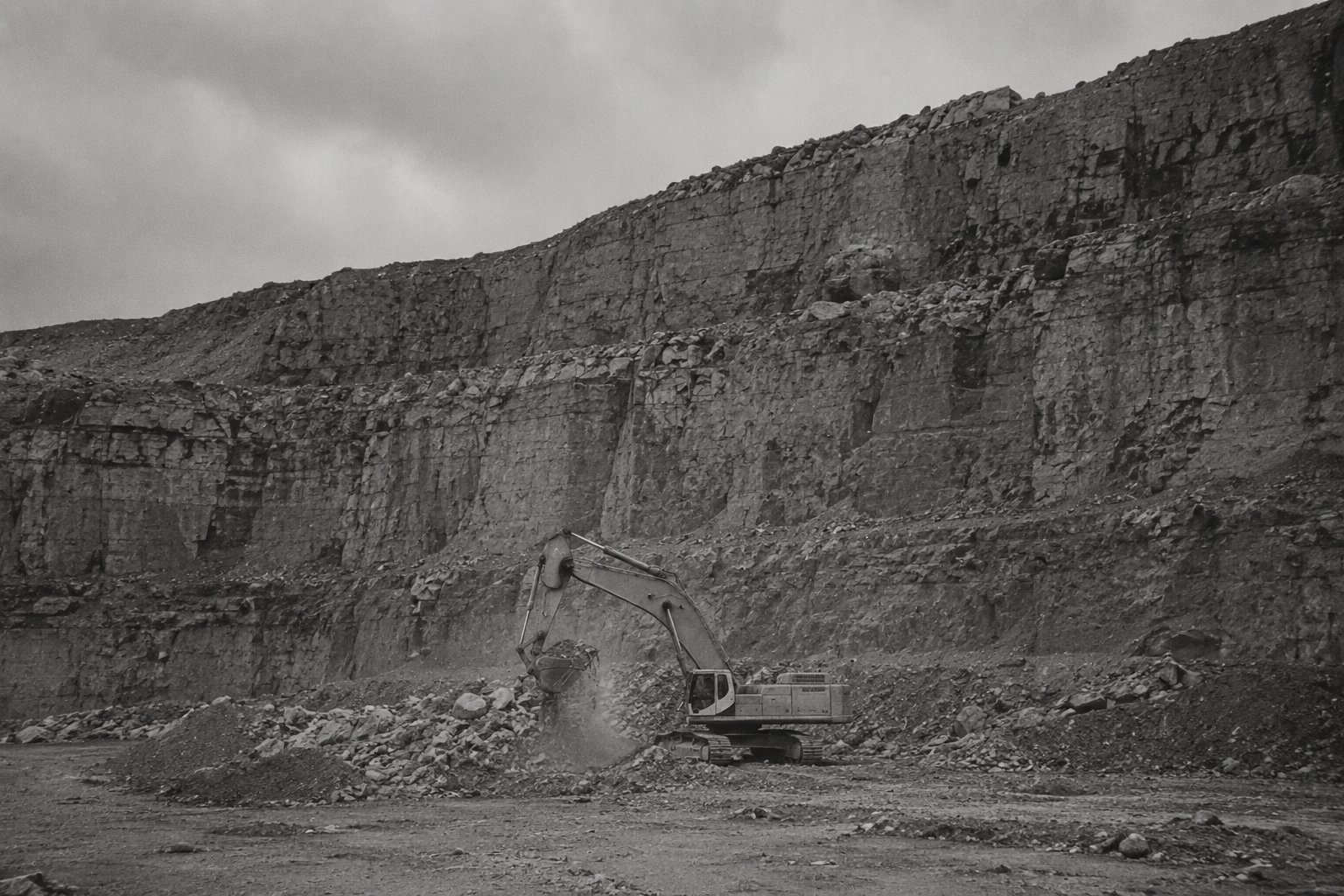 An excavator working a gravel quarry